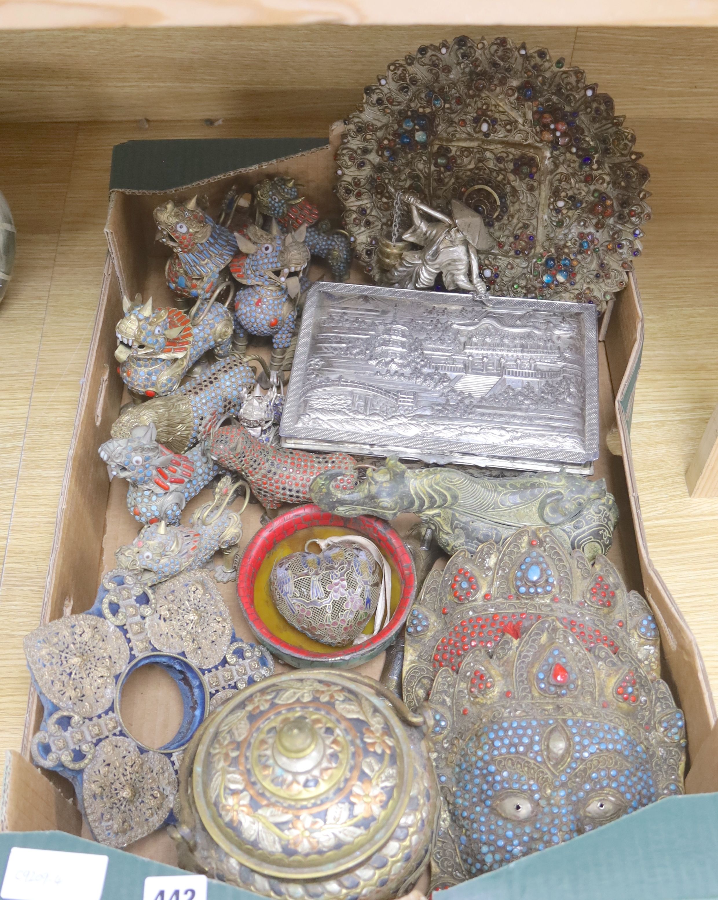 A group of Tibetan style metalware figures, masks, ornaments, etc.